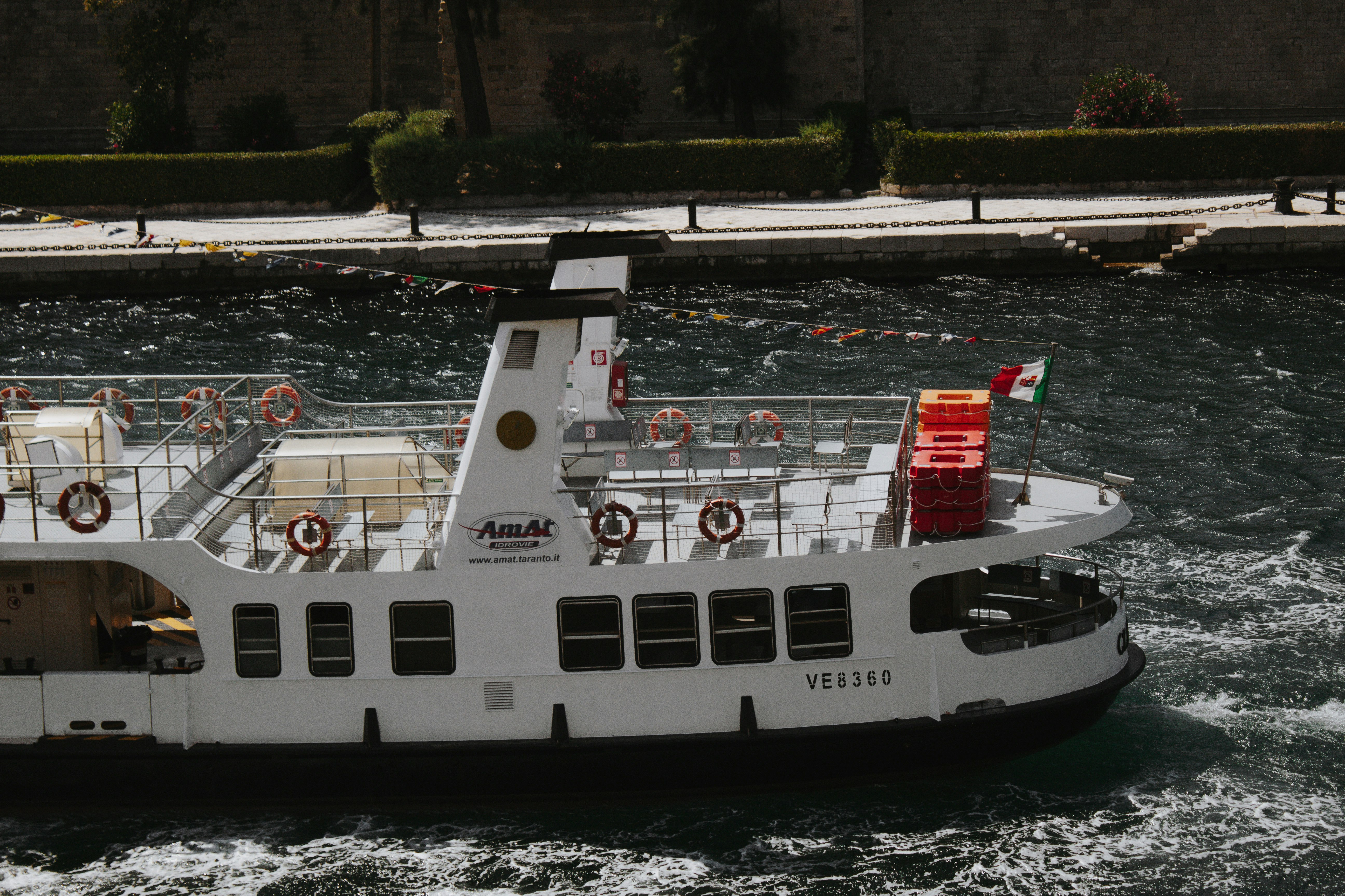 white and black ship on water during daytime